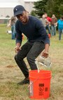 Airman 1st Class Michael Robinson, National Air and Space Intelligence Center, competes in a beer jug relay during the center's 47th Annual Oktoberfest celebration at Bass Lake, Oct. 2, 2015. NASIC Airmen compete in Oktoberfest Cup competitions to earn center bragging rights; events consist of a keg toss, log sawing contest, beer jug relay, and beer tasting. (U.S. Air Force photo by Senior Airman Samuel Earick)