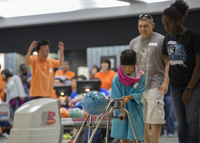 A Special Olympics athlete competes in a bowling competition during the Special Olympics Hiroshima at the Strike Zone Bowling Center at Marine Corps Air Station Iwakuni, Japan, Oct. 4, 2015. As the last event before the Olympians received their medals, the special Olympics maintained its inspirational tempo by promoting a competitive atmosphere, camaraderie and sportsmanship.