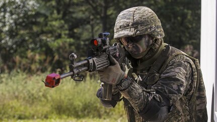 Republic of Korea Marine Cpl. Ikjun Cho holds security as U.S. and ROK Marines practice urban operations during Korean Marine Exchange Program 15-12 at Gunha-Rhi, Gimpo, Republic of Korea, Sept. 17, 2015. KMEP 15-12 is a bilateral training exercise that enhances the ROK and U.S. alliance, promotes stability on the Korean Peninsula and strengthens ROK and U.S. military capabilities and interoperability. Cho, from Jeju Island, ROK, is a rifleman with 1st Company, 11th Battalion, 1st Regiment, 2nd Marine Division. The U.S. Marines are with Fox Company, 2nd Battalion, 3rd Marine Regiment, currently assigned to 4th Marine Regiment, 3rd Marine Division, III Marine Expeditionary Force under the unit deployment program. (U.S. Marine Corps photo by Cpl. Tyler S. Giguere/ Released)