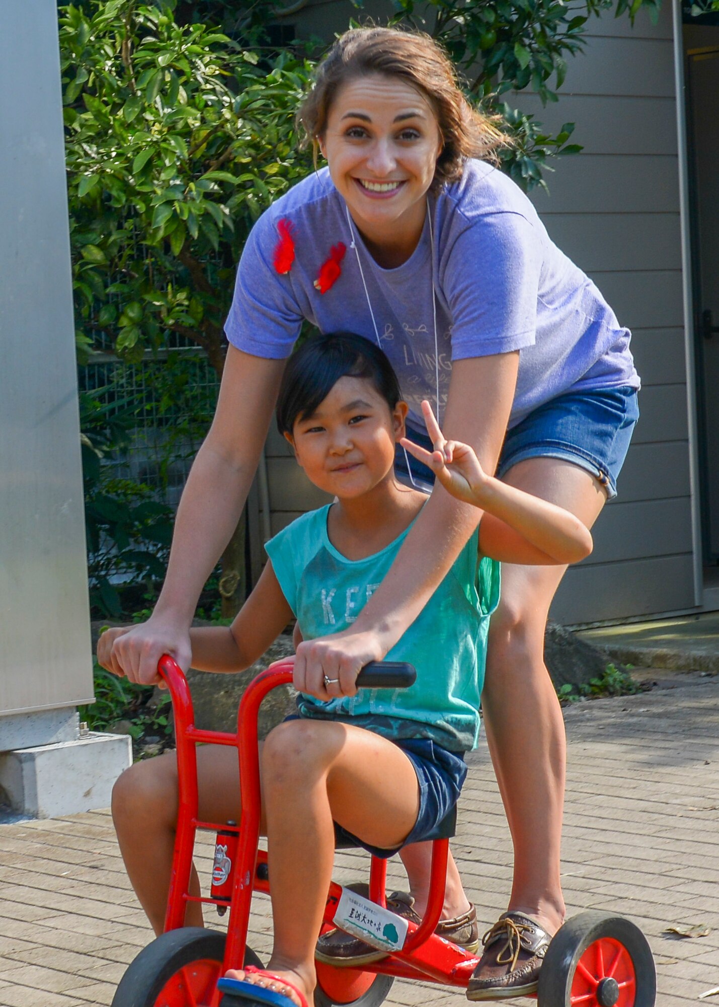 2nd Lt. Samantha Laughlin, 374th Force Support Squadron military personnel section chief, plays with Haruka, a child at Shisei Gakuen orphanage in Tokyo, Japan, Oct. 3, 2015. There are approximately 140 children at Shisei Gakuen, mostly from abusive homes. (U.S. Air Force photo by Airman 1st Class Elizabeth Baker/Released)