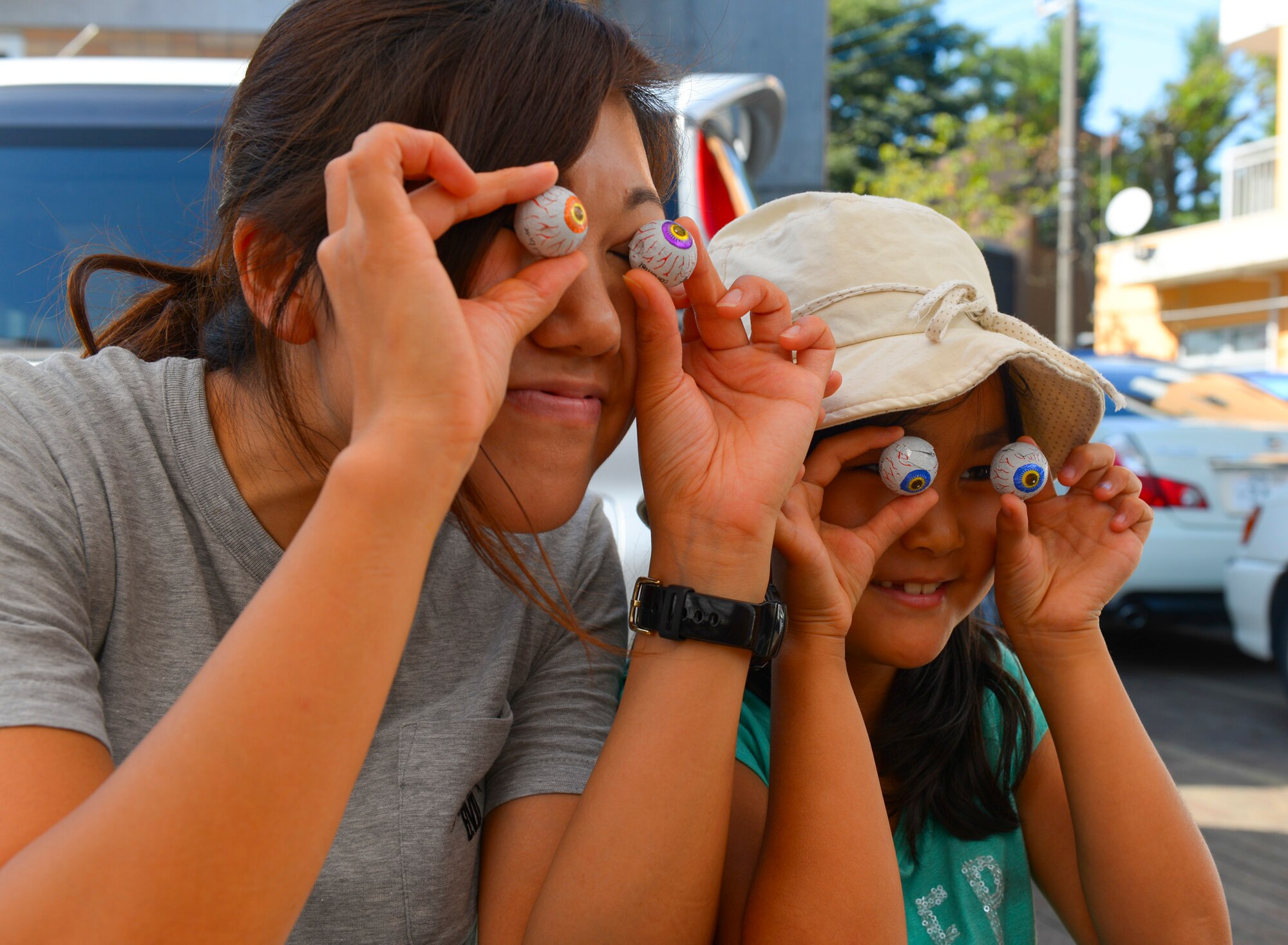 A volunteer teacher at Shisei Gakuen orphanage poses plays with toys eyes in Tokyo, Japan, Oct. 3, 2015. Yokota volunteers brought friendship and encouragement to members of the Tokyo community by spending time with children of Shisei Gakuen orphanage. (U.S. Air Force photo by Airman 1st Class Elizabeth Baker/Released)