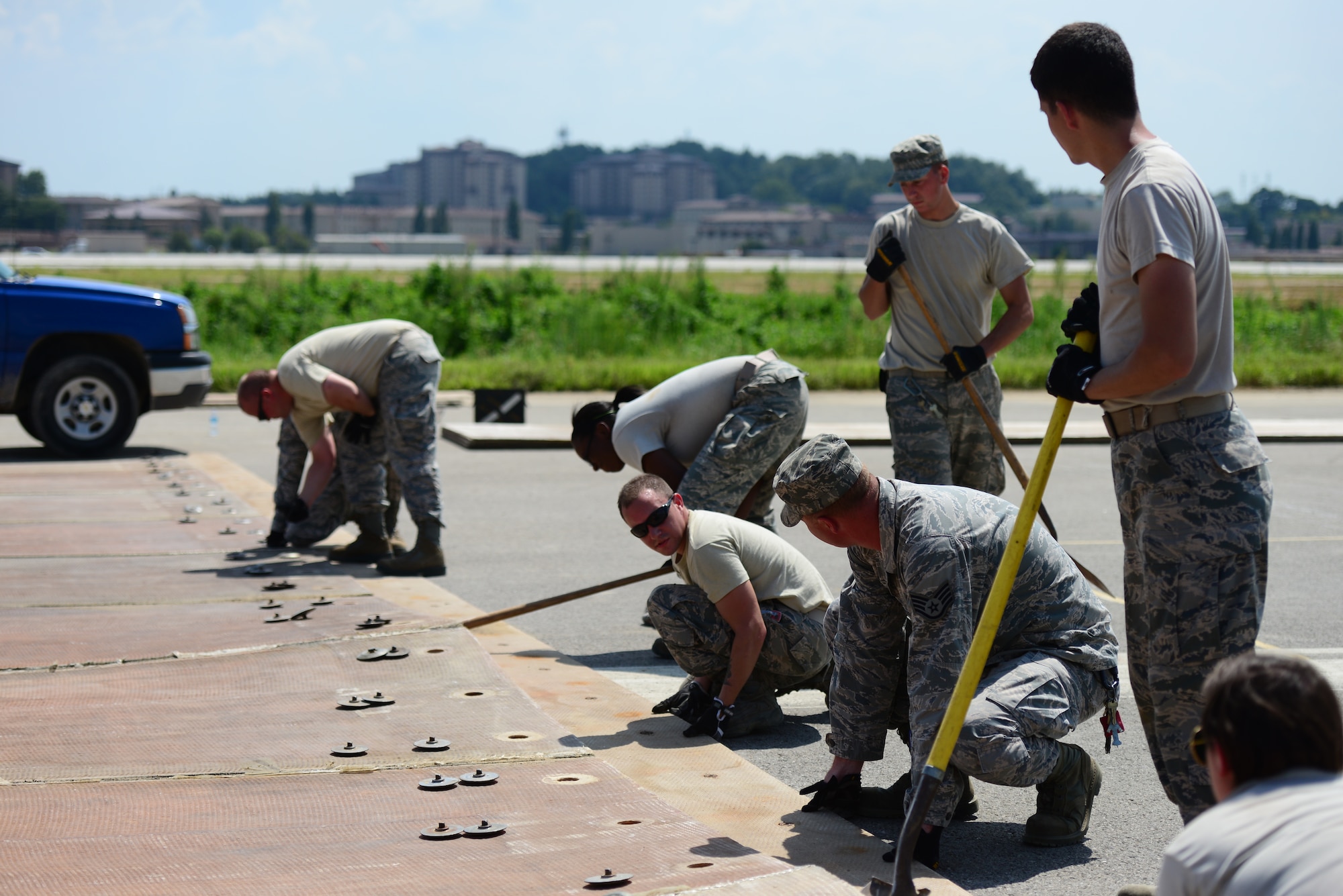 Airmen from the 51st Civil Engineer Squadron structures shop put together a rapid-runway repair fiberglass mat as part of airfield damage-repair drills at Osan Air Base, Republic of Korea, Aug. 18, 2015.  Known as the catch-all career field, structures Airmen have a job that can vary from the indoors to the outdoors, from homes and office buildings to the flightline and everywhere in between.
(U.S. Air Force photo/Staff Sgt. Amber Grimm)