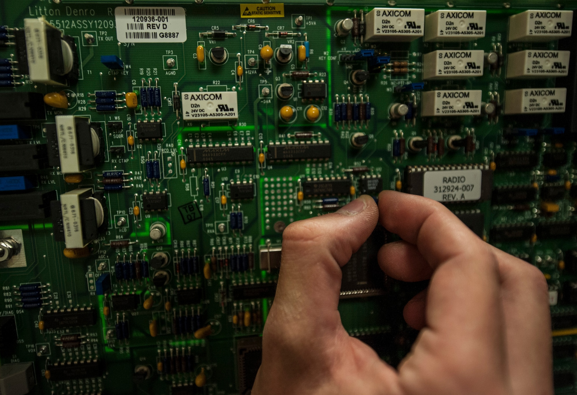 Senior Airman James Vrtis, 57th Operations Support Squadron airfield systems technician, works on a circuit board at the air traffic control tower on Nellis Air Force Base, Nev., Oct. 6, 2015. Airfield systems specialists are charged with ensuring Airmen on the airfield and in the air traffic control tower always have a clear line of communication with local and transient pilots in the air. (U.S. Air Force photo by Staff Sgt. Siuta B. Ika)