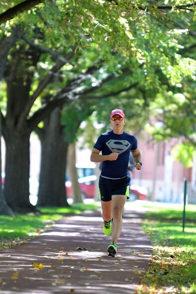 U.S. Army Lt. Col. Trey Hadaway, United States Strategic Command, runs in the inaugural Breast Cancer Awareness 5K Oct. 2 on the Offutt Air Force Base, Neb., parade grounds.  Personnel from across Team Offutt participated in the run.  (U.S. Air Force photo by Josh Plueger/Released)