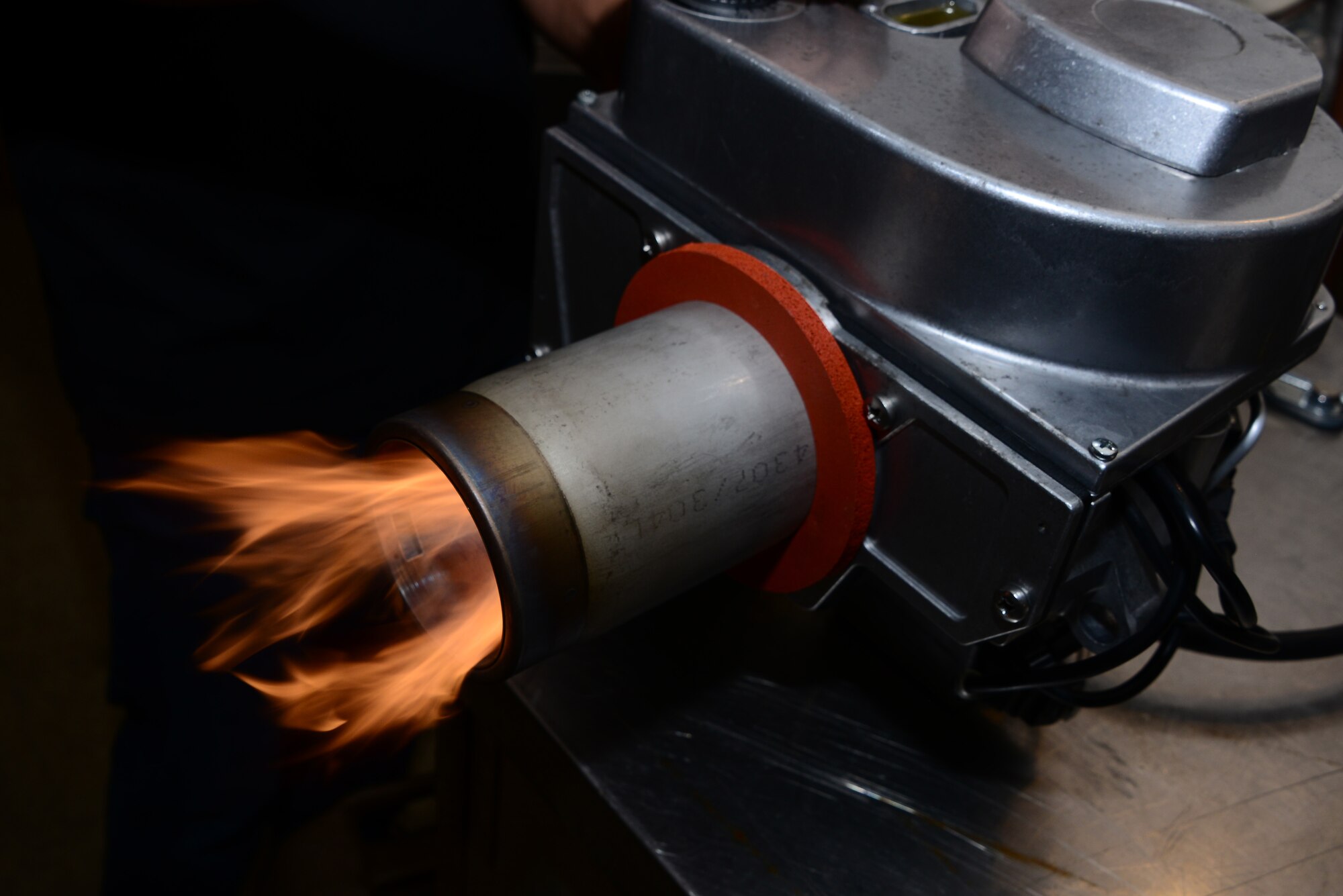 A Babington Airtronic burner functions during expeditionary kitchen training at Davis-Monthan Air Force Base, Ariz., Sept. 30, 2015. The Airmen that attended the training learned how to break down and reassemble the burner. (U.S. Air Force photo by Airman 1st Class Mya M. Crosby/Released)
