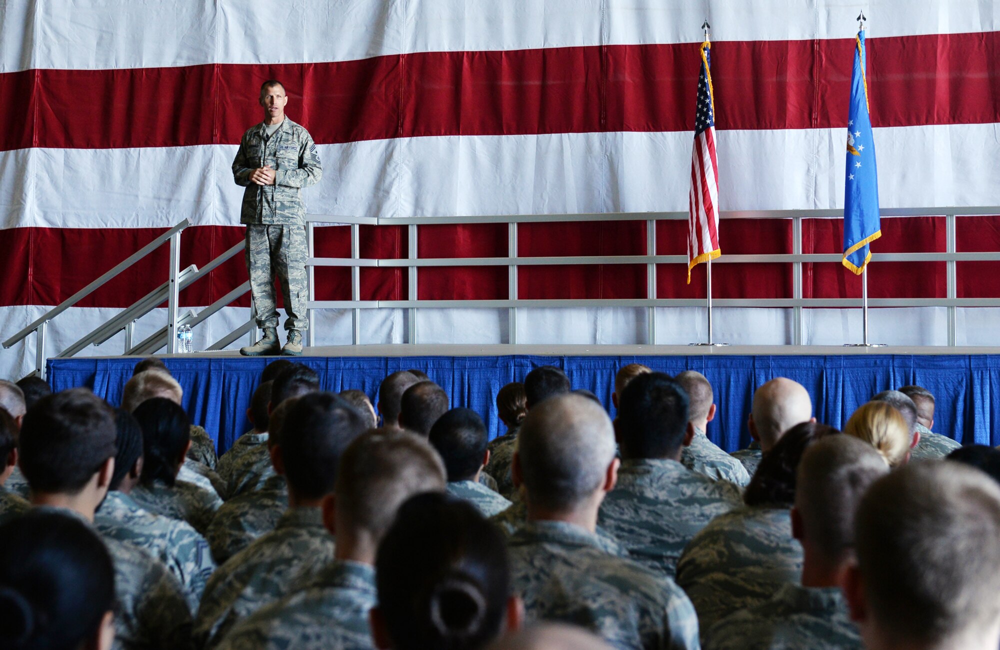 Chief Master Sgt. Steve McDonald, Air Combat Command’s command chief, speaks to members of Team Offutt Oct. 1 during an enlisted all-call at the Bennie Davis Maintenance Facility. During the all-call several Airmen were coined, the chief conveyed his goals and the floor was opened for a question-and-answer session. (U.S. Air Force photo by Charles Haymond/Released)