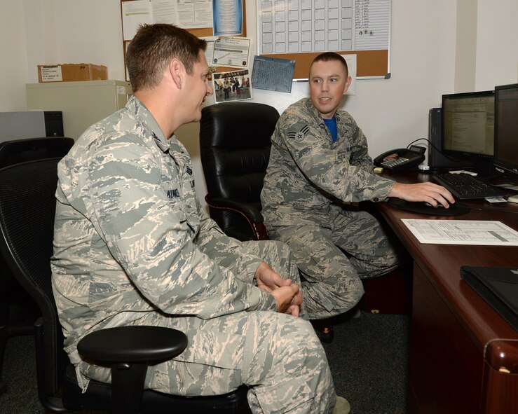 Senior Airman Larry Wildhaber, 325th Aerospace Medical Squadron public health technician, explains to Col. Joseph D. Kunkel, 325th Fighter Wing vice commander, the process to medically clear Airmen for deployments. Every Airman that deploys from Tyndall must go through a series of medical evaluations to ensure they are physically and mentally ready to endure the stresses of a deployed environment. (U.S. Air Force photo by Airman 1st Class Cody R. Miller/Released) 