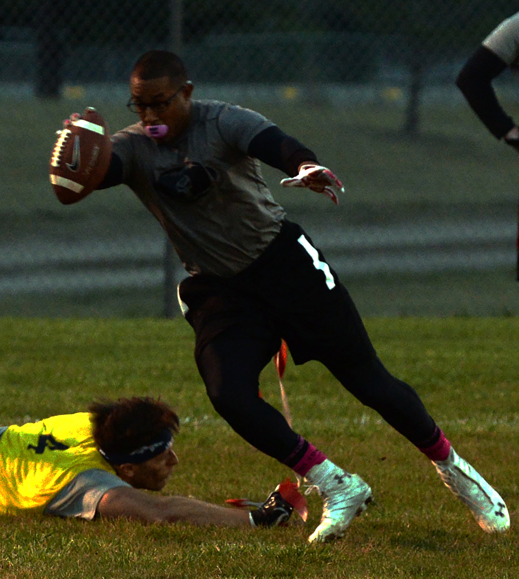 Nathan Aiken, 790th Missile Security Forces, snags the flags off Jason Jackson, Tactical Response Force, during the 90th Missile Wing intermural flag football championship game on F.E. Warren Air Force Base, Wyo., Oct 5, 2015. The 790th team fought back from the loser’s bracket to beat the defending champions. (U.S. Air Force photo by Senior Airman Brandon Valle)
