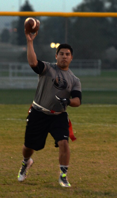 Ronnie Perez, 790th Missile Security Forces Tactical Response Force, fires a pass Oct. 5, 2015, during the 90th Missile Wing intermural flag football championship game on F.E. Warren Air Force Base, Wyo. (U.S. Air Force photo by Senior Airman Brandon Valle)