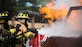 Airman 1st Class Austyn Helgeson and Senior Airman Scott Burdick, 11th Wing Civil Engineer firefighters, put out a fire during a live fire exercise at Joint Base Andrews, Md., Oct. 7, 2015. The exercise was part of the fire prevention week on JBA. (U.S Air Force photo by Airman 1st Class Philip Bryant/Released)