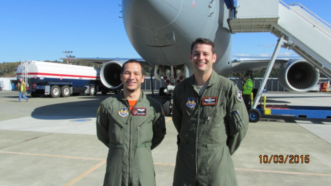 Capt. Julio Alvarez (left) and Lt. Col. James Quashnock stand in front EMD-1, the 767-2C that first flew late last year, at Boeing Field shortly after they were cleared to participate in flight testing. The Airmen, both experienced flight test pilots, will be responsible for military certification of Pegasus systems.
