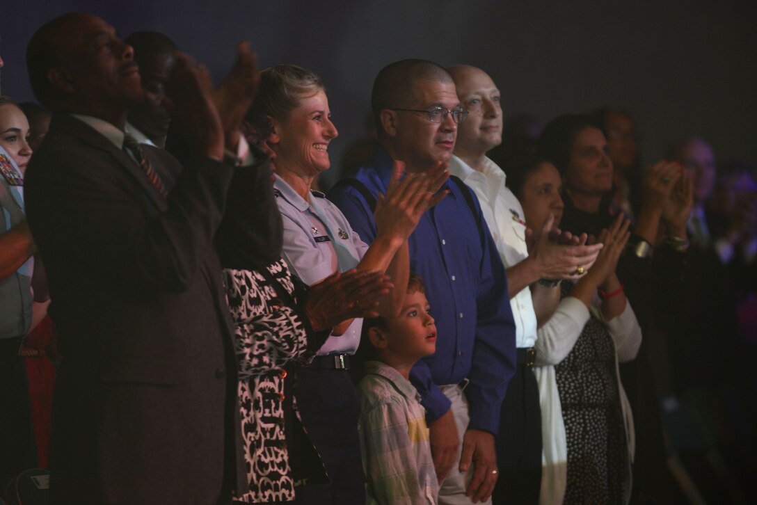 U.S. Air Force Col. Caroline M. Miller, 633rd Air Base Wing commander, and her family, watch the Tops in Blue performance at the Hampton Convention Center in Hampton, Va., Oct. 6, 2015. Before the show began, Miller thanked supporters and the performers. (U.S. Air Force photo by Senior Airman Kimberly Nagle/Released)