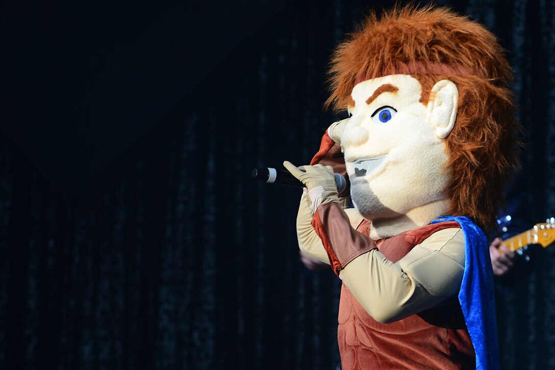 “Hercules” makes an appearance during the Tops in Blue performance at the Hampton Convention Center in Hampton, Va., Oct. 6, 2015. After being joined on stage by other super hero mascots, the members of Tops in Blue helped recognize “heroes” from Joint Base Langley-Eustis, Va. (U.S. Air Force photo by Senior Airman Kimberly Nagle/Released)