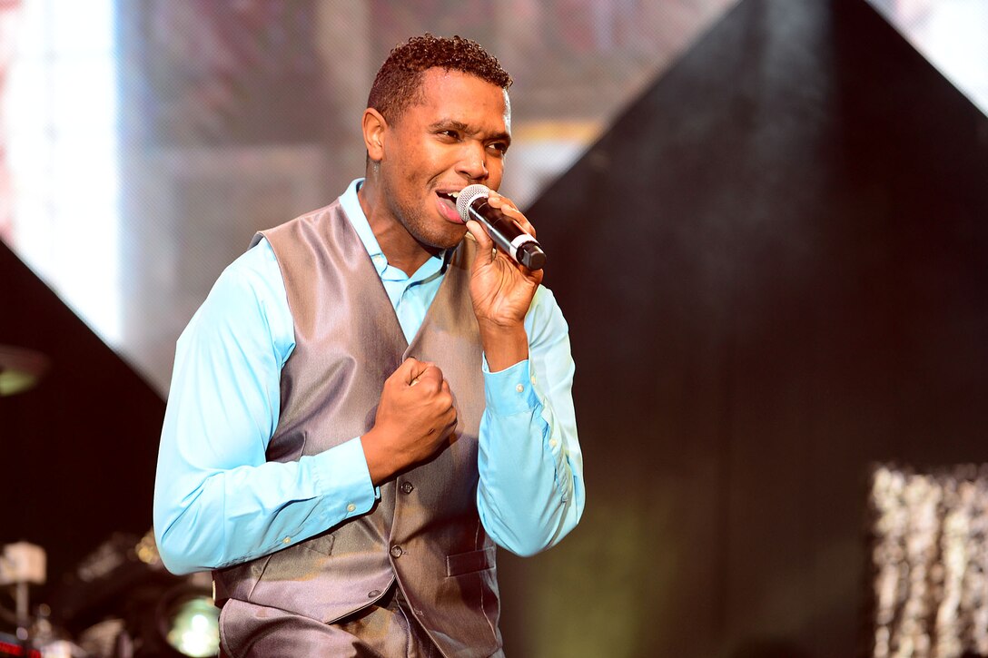U.S. Air Force Senior Airman Jordan Whitehead, Tops in Blue vocalist, performs at the Hampton Roads Convention Center in Hampton, Va., Oct. 6, 2015. Whitehead is a member of a world tour that travels throughout the U.S. during a 7-month period, performing up to 75 times, including shows for deployed U.S. Service members. (U.S. Air Force photo by Senior Airman Kimberly Nagle/Released)