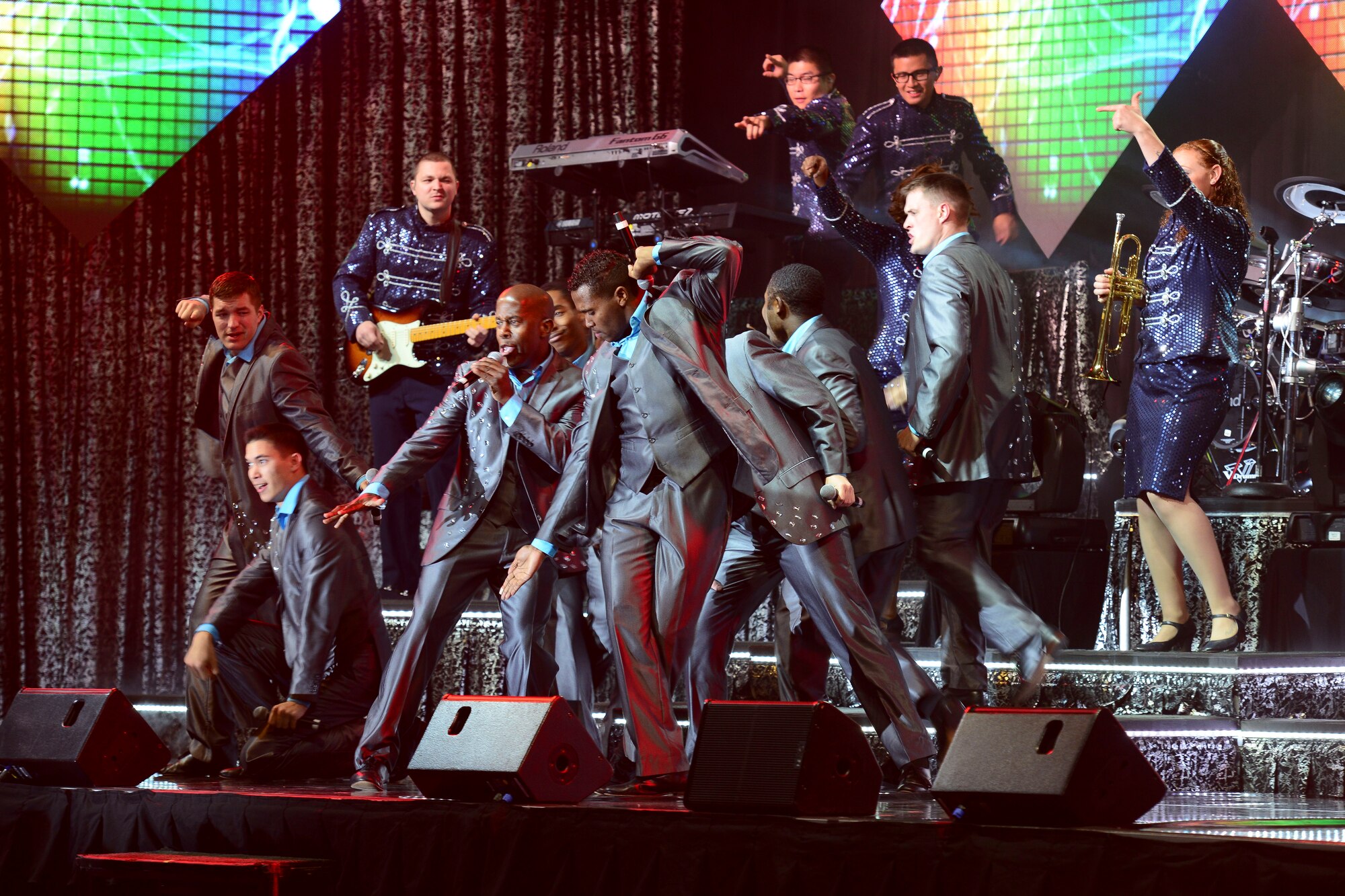 U.S. Air Force Airmen assigned to Tops in Blue perform a song during a performance at the Hampton Roads Convention Center in Hampton, Va., Oct. 6, 2015. The first cast entertained over 320,000 Active duty military members and their families in the 1950’s. (U.S. Air Force photo by Staff Sgt. Ciara Gosier/Released)