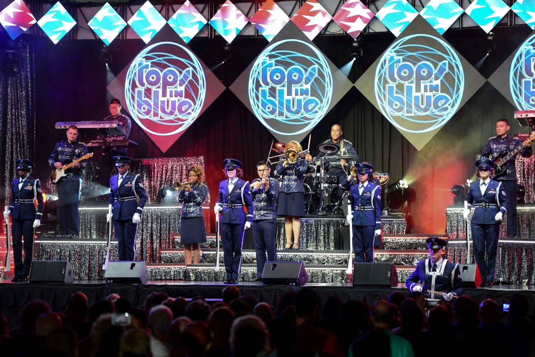 U.S. Air Force Airmen assigned to Tops in Blue perform the national anthem at the Hampton Roads Convention Center in Hampton, Va., Oct. 6, 2015. The group of Airmen is composed of the most talented vocalists, musicians, dancers and technicians from different bases around the world. (U.S. Air Force photo by Staff Sgt. Ciara Gosier/Released) 