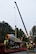 Members of the 4th Civil Engineer Squadron heavy equipment and 4th Equipment Maintenance Squadron repair and reclamation shops lower a restored F-86H Sabre onto a trailer, Oct. 6, 2015, at Seymour Johnson Air Force Base, North Carolina. Members from the installation handed off the jet to city contractors who returned it to its display at the Goldsboro Police Department. (U.S. Air Force photo/Senior Airman Aaron J. Jenne)