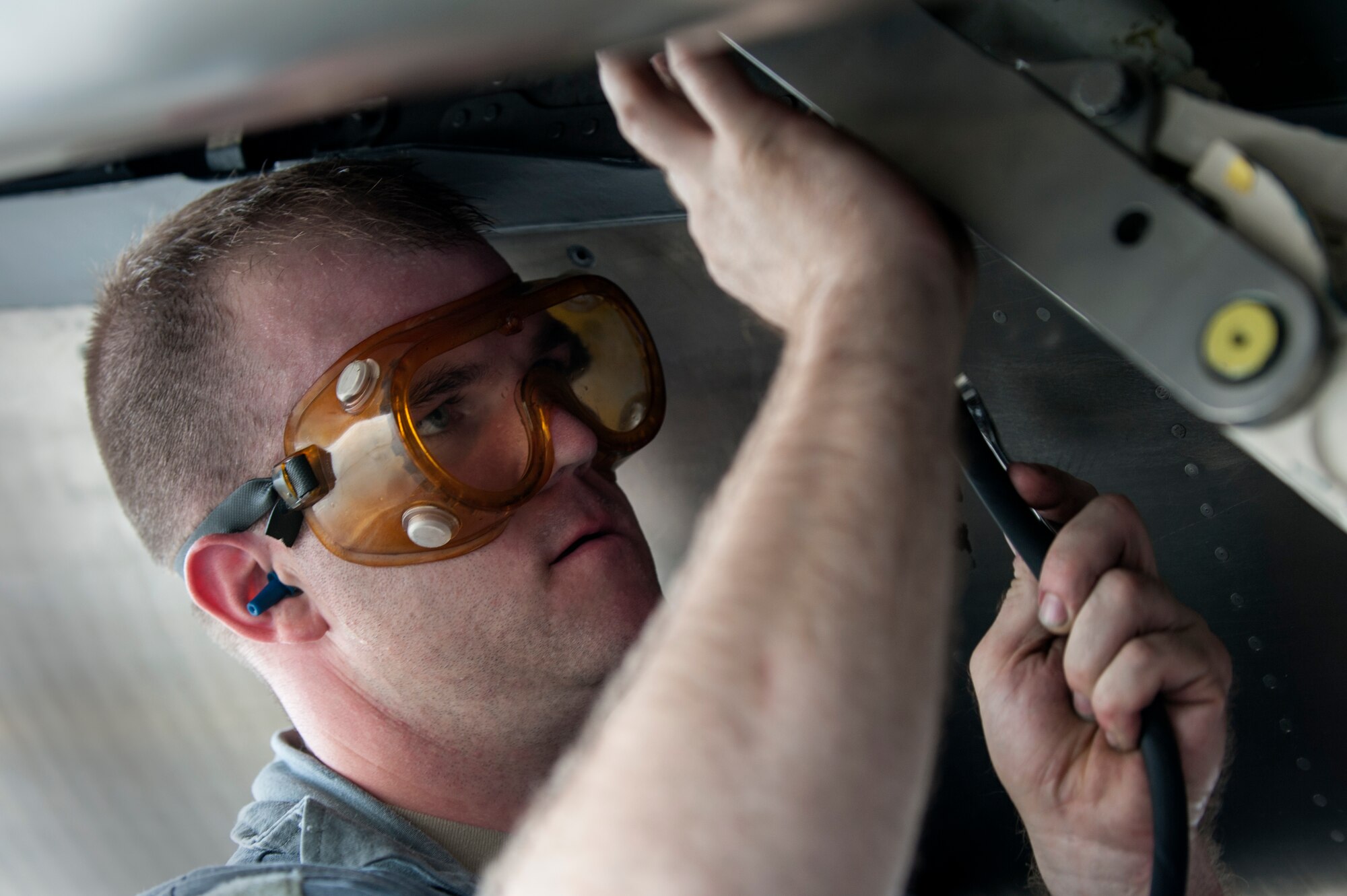 Senior Airman Ashley Irelan, 4th Aircraft Maintenance Squadron crew chief, works on the tail hook of an F-15E Strike Eagle as part of a 9th Air Force aircraft generation exercise, Sept. 10, 2015, at Seymour Johnson Air Force Base, North Carolina. Generation exercises not only allow veteran maintenance crews to put their knowledge to the test, but allow new Airmen to become familiar with processes. (U.S. Air Force photo/Airman Shawna L. Keyes)