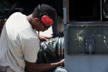 Airman 1st Class Justin Morgan, 4th Aircraft Maintenance Squadron weapons technician, attaches a hose to a piece of aerospace ground equipment as part of a 9th Air Force aircraft generation exercise, Sept. 10, 2015, at Seymour Johnson Air Force Base, North Carolina. The exercise evaluated the wing’s ability to prepare and launch aircraft anywhere in the world at a moment’s notice. (U.S. Air Force photo/Airman Shawna L. Keyes)