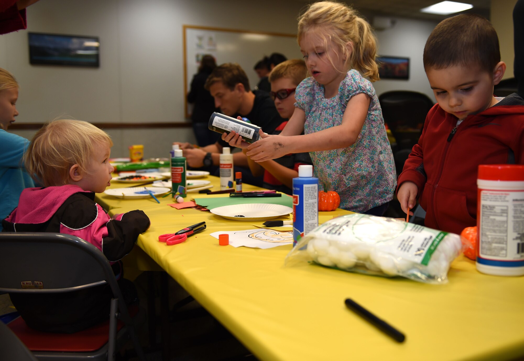 Children participate in arts and crafts at the deployed family dinner at the Chapel Support Center on Joint Base Lewis-McChord, Wash., Oct. 2, 2015. Families who participated in the event received a bag of popcorn upon arrival, had several activity options to choose from and even entered into a free raffle. (U.S. Air Force photos/Senior Airman Naomi Griego)