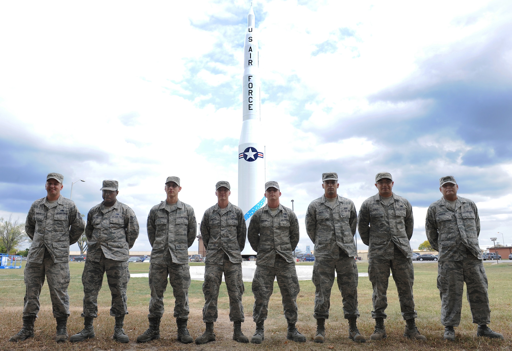 Members of the 509th Maintenance Squadron low observable shop stand in front of a restored Minuteman II Missile static display at Whiteman Air Force Base, Mo., Sept. 29, 2015. The low observable technicians were recognized by base leadership for the restoration project. (U.S. Air Force photo by Airman 1st Class Michaela R. Slanchik/Released)