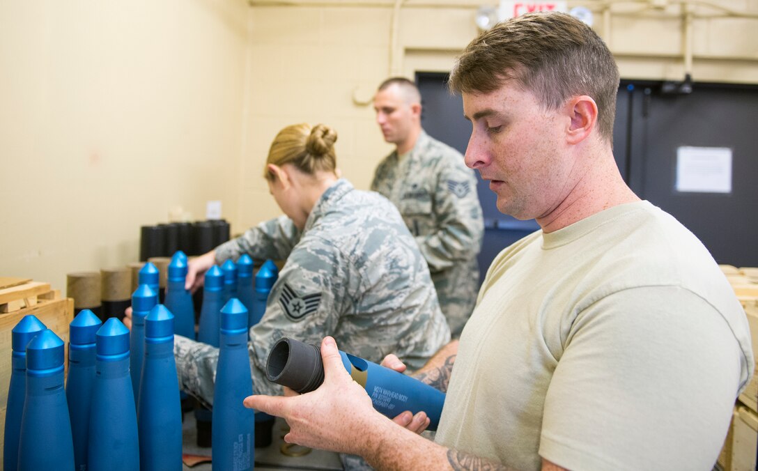 U.S. Air Force Senior Airman John Swinney, 23d Equipment Maintenance Squadron munitions inspector, checks for damage on an M247 rocket warhead during a periodic inspection, Oct. 6, 2015, at Moody Air Force Base, Ga. The munitions flight inspection section averages five to six scheduled inspections per week while additionally monitoring records and supporting emergency situations. (U.S. Air Force photo by Airman 1st Class Greg Nash/Released)