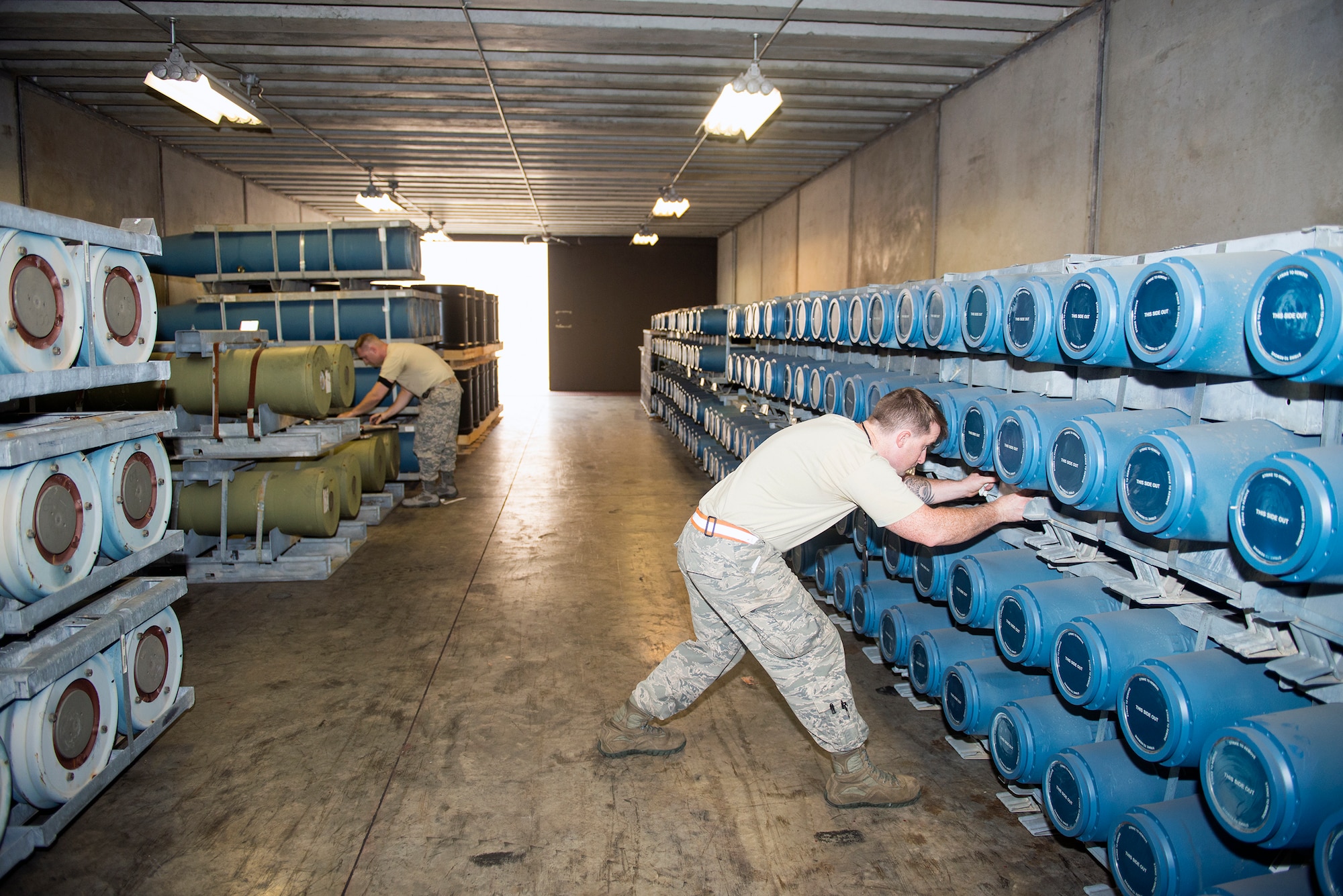 U.S. Air Force Senior Airman John Swinney, 23d Equipment Maintenance Squadron munitions inspector, checks for damage on an M247 rocket warhead during a periodic inspection, Oct. 6, 2015, at Moody Air Force Base, Ga. The munitions flight inspection section averages five to six scheduled inspections per week while additionally monitoring records and supporting emergency situations. (U.S. Air Force photo by Airman 1st Class Greg Nash/Released)