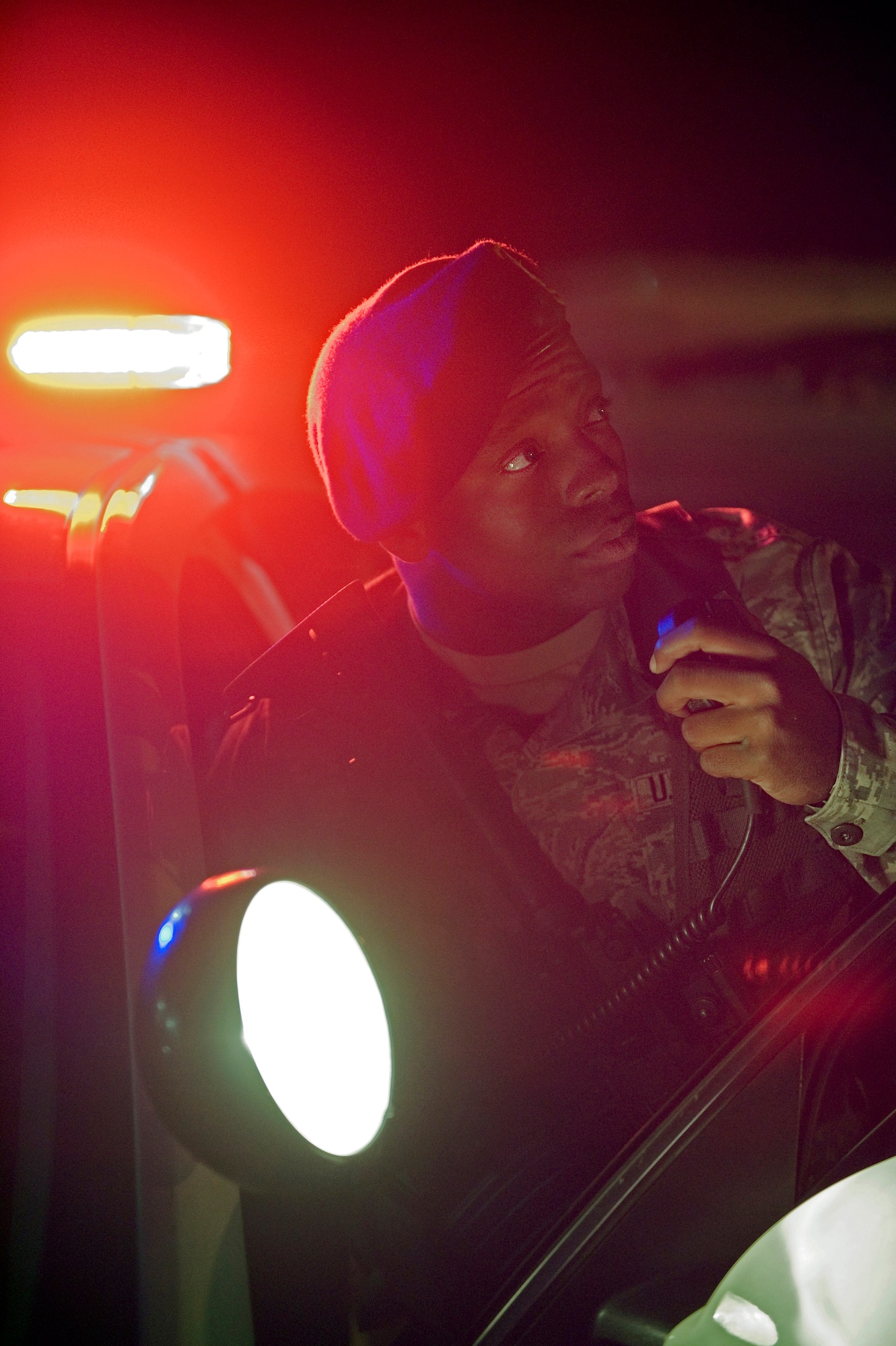 Senior Airman Marshall Berry, 434th Security Forces Squadron fire team member, speaks on his patrol-car radio during a training exercise at Grissom Air Reserve Base, Ind., Sept. 29, 2015. With over 1,200 acres of land, more than two billion dollars of real property and 16 KC-135s valued at approximately fifty-two million dollars each the 434th SFS plays a vital role protecting Grissom's resources. (U.S. Air Force Photo/Tech. Sgt. Benjamin Mota) 