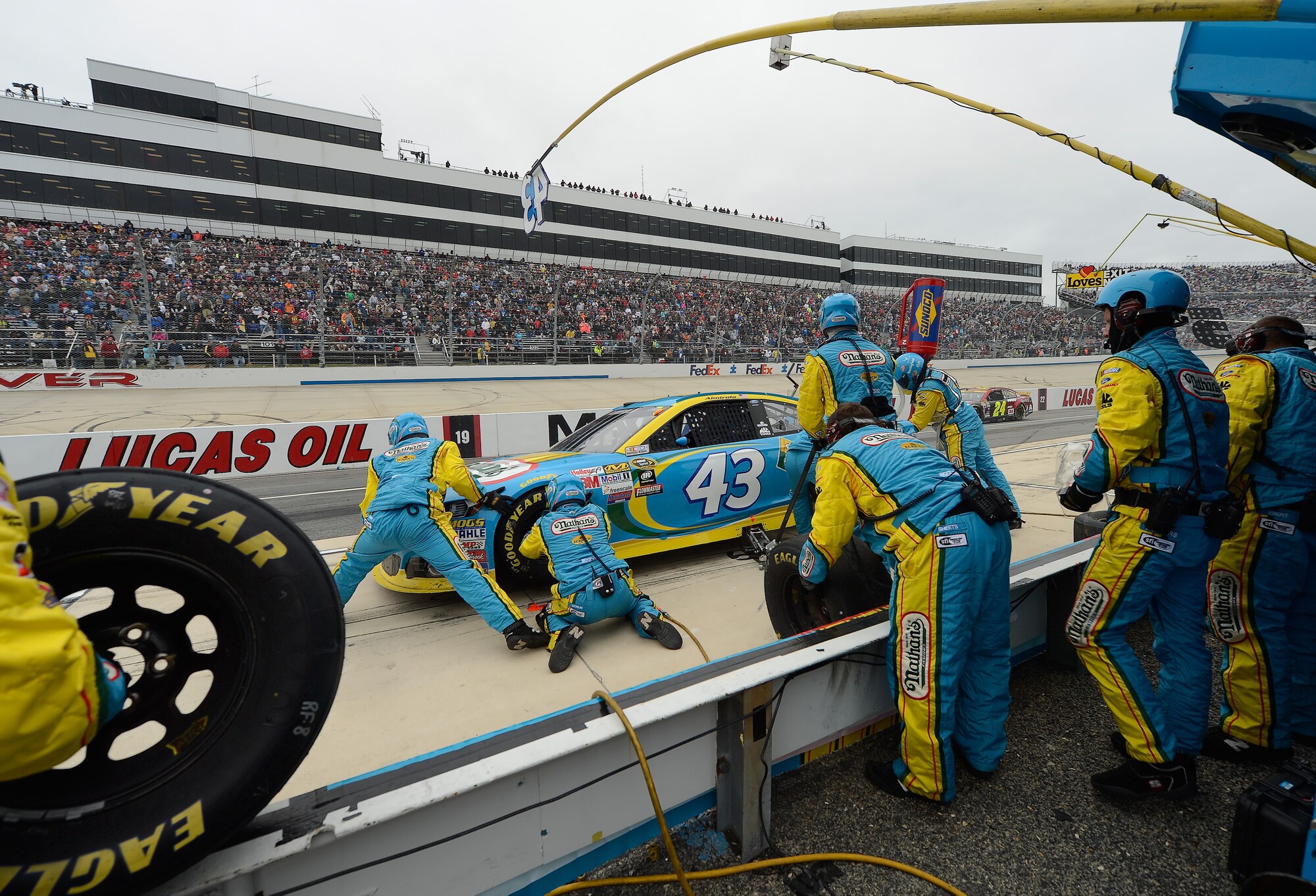 The Smithfield Foods Ford driven by Aric Almirola gets a new set of tires and tops-off on fuel during a pit-stop during the 2015 AAA 400 NASCAR Sprint Cup Series race at Dover International Speedway Oct. 4, 2015, in Dover, Del. The Richard Petty Motorsports team is partially sponsored by the U.S. Air Force. (U.S. Air Force photo/Greg L. Davis) 