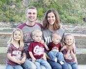 Capt. Clayton Cox, 341st Missile Wing assistant staff judge advocate, left, poses for a photograph with his family. Cox was recently selected to attend the U.S. Air Force International Squadron Officer School. (Courtesy photo)