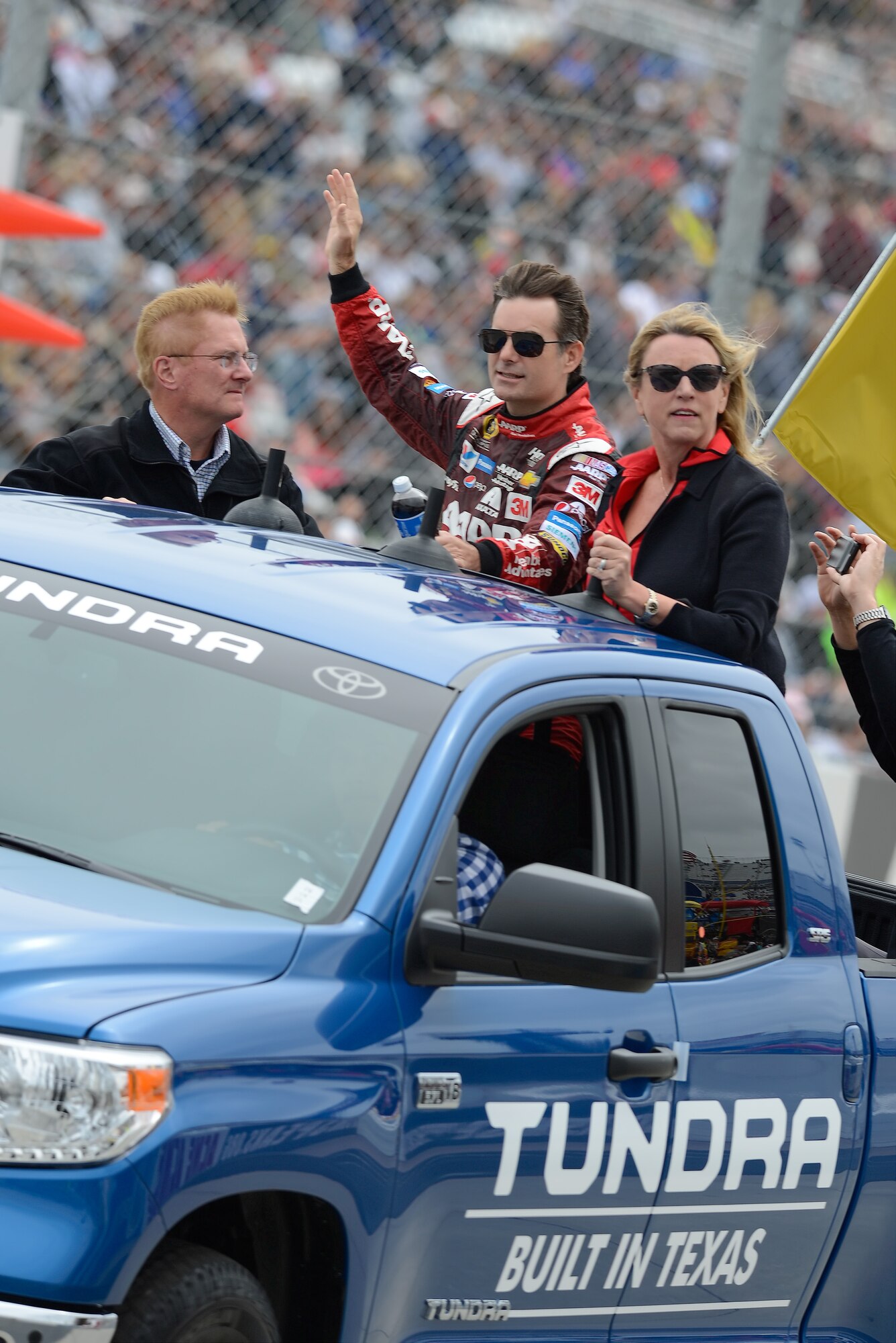 Secretary of the Air Force Deborah Lee James, right, rides with NASCAR driver Jeff Gordon in the back of a 2015 Toyota Tundra truck during the driver introduction lap for the 2015 AAA 400 NASCAR Sprint Cup Series race Oct. 4, 2015, at Dover International Speedway in Dover, Del. James was the guest of the track and also drove the official pace car to start the race. (U.S. Air Force photo/Greg L. Davis)