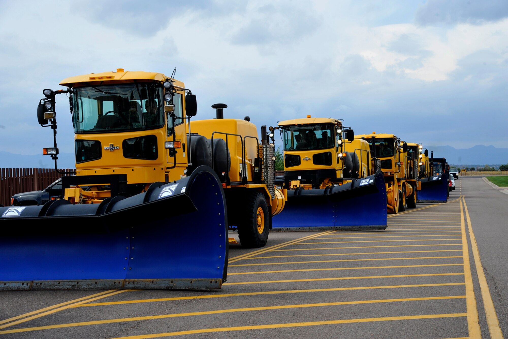 PETERSON AIR FORCE BASE, Colo. –21st Civil Engineer Squadron snow removal equipment is lined up for the annual “Snow Parade” down Peterson Boulevard on Sept. 29, 2015. The parade visited children at the Child Development Centers and youth center and let them explore the machinery. The annual parade is a way to show off the CES equipment and crews who work to make Peterson roadways safe and emphasize the need to keep roadways clear and accessible for emergency vehicles. (U.S. Air Force photo by Robb Lingley)