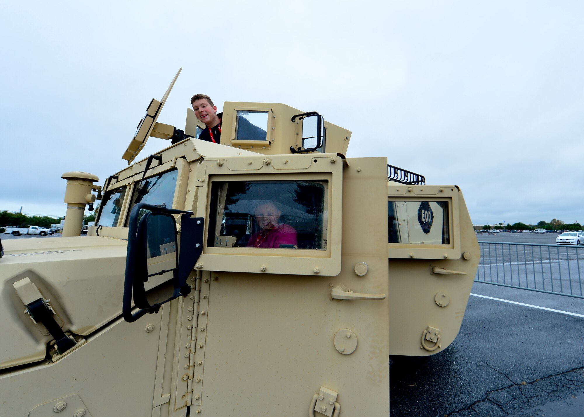 Charles and Jenna Romano pose for a photo in a M1165 Humvee from the 436th Civil Engineer Squadron Explosive Ordinance Disposal Flight Oct. 3, 2015, in the Monster Fun Zone at Dover International Speedway in Dover, Del. Charles and Jenna traveled with their family from Staten Island, N.Y., to watch the 2015 Hisense 200 NASCAR Xfinity Series race at the speedway. (U.S. Air Force photo/Senior Airman William Johnson)