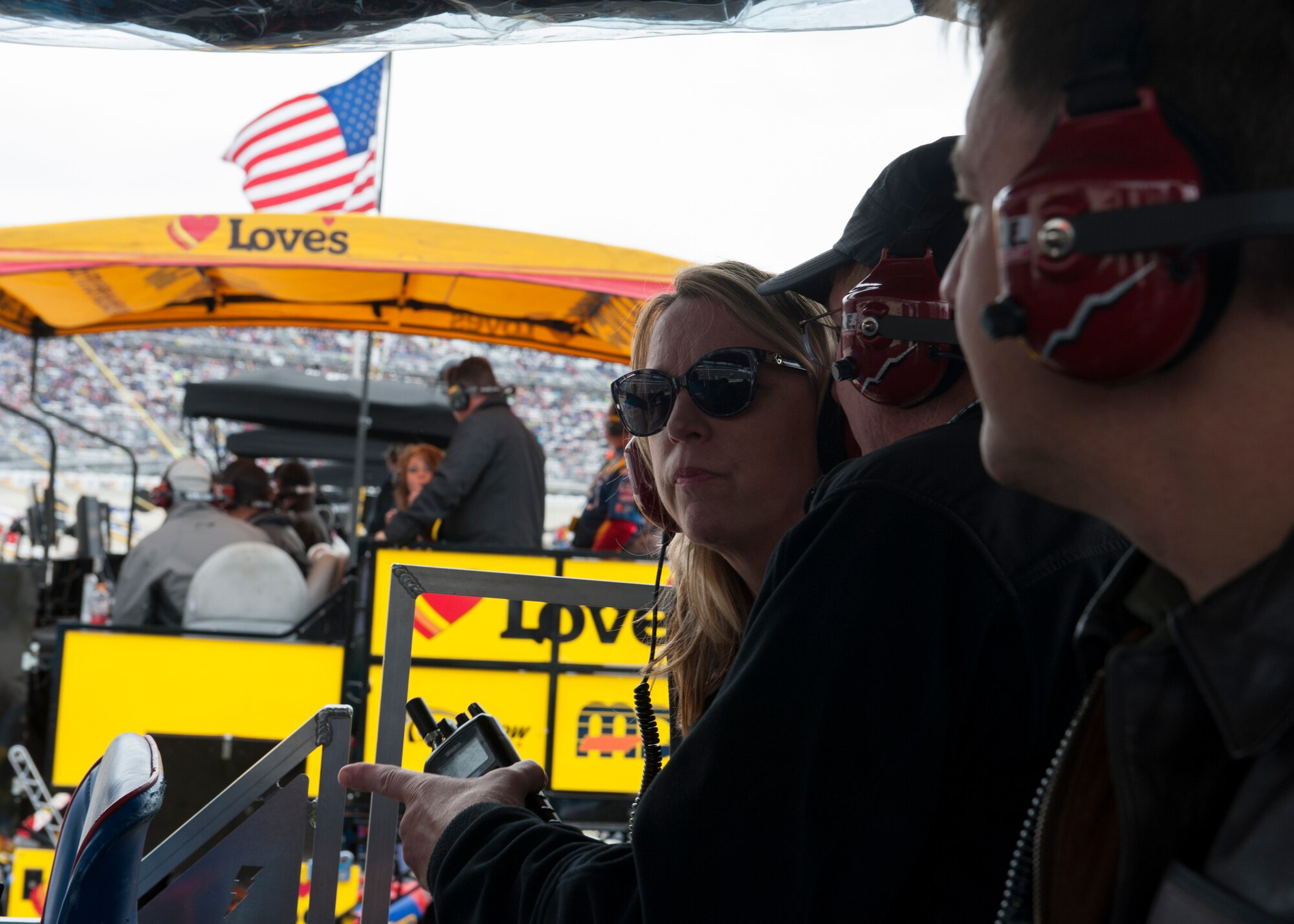 Secretary of the Air Force Deborah Lee James watches the 2015 AAA 400 NASCAR Sprint Cup Series race from inside the #43 Ford Fusion Pit Box Oct. 4, 2015, at Dover International Speedway in Dover, Del. The pit box gave James a bird’s eye view of pit road and a headset gave her up-to-date information about the race. (U.S. Air Force photo/ Senior Airman Zachary Cacicia)