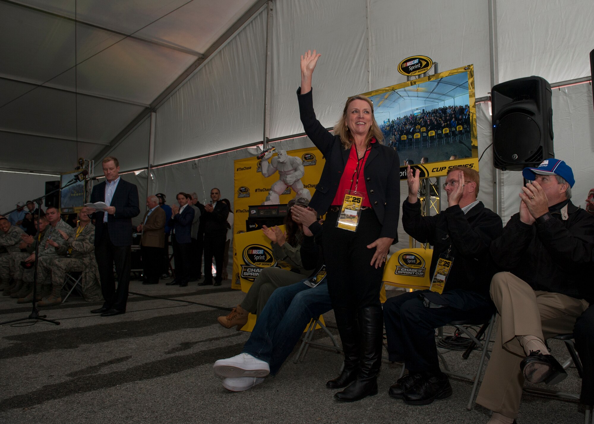 Secretary of the Air Force Deborah Lee James waves as she is recognized during the drivers meeting prior to the start of the 2015 AAA 400 NASCAR Sprint Cup Series race Oct. 4, 2015, at Dover International Speedway in Dover, Del. The drivers’ meeting was attended by all 43 drivers and their crew chiefs. (U.S. Air Force photo/ Senior Airman Zachary Cacicia)