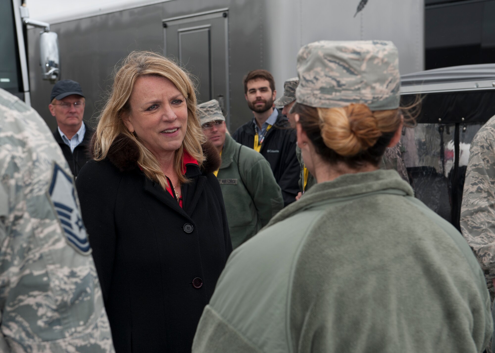 Secretary of the Air Force Deborah Lee James speaks to Airman 1st Class Laura Dolch, 436th Operations Support Squadron airfield management operations coordinator, during 2015 AAA 400 NASCAR Sprint Cup Series race pre-race activities Oct. 4, 2015, at Dover International Speedway in Dover, Del. Secretary James met with Team Dover Airmen who were taking part in the race weekend. (U.S. Air Force photo/ Senior Airman Zachary Cacicia) 