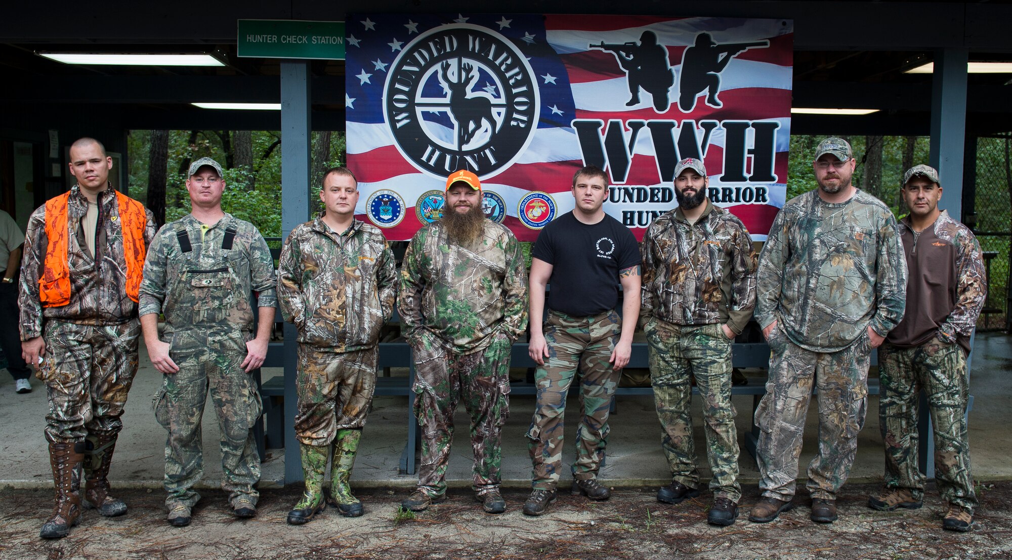 Wounded warriors participating in the 2015 Wounded Warrior Hunt gather for a group photo Oct. 2, 2015, at the hunter check station on Joint Base Charleston – Weapons Station, S.C. The Wounded Warrior project’s purpose is to provide unique, direct programs and services to meet the needs of injured service members, help injured service members aid and assist each other and raise awareness and enlist the public’s help in meeting the needs of injured service members. (U.S. Air Force photo/Airman 1st Class Clayton Cupit)