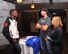 Neil Magny, currently ranked 12th in the Ultimate Fighting Championship’s welterweight division, talks with Paul Loede, 55th Contracting Squadron contract administrator, and his wife, Trisha, 55th Force Support Squadron community service flight chief, at Fight Night Oct. 3, 2015, at the Patriot Club, Offutt Air Force Base, Neb. Magny met with Team Offutt personnel and joined them as they watched UFC 192. (U.S. Air Force photo by D.P. Heard/Released)