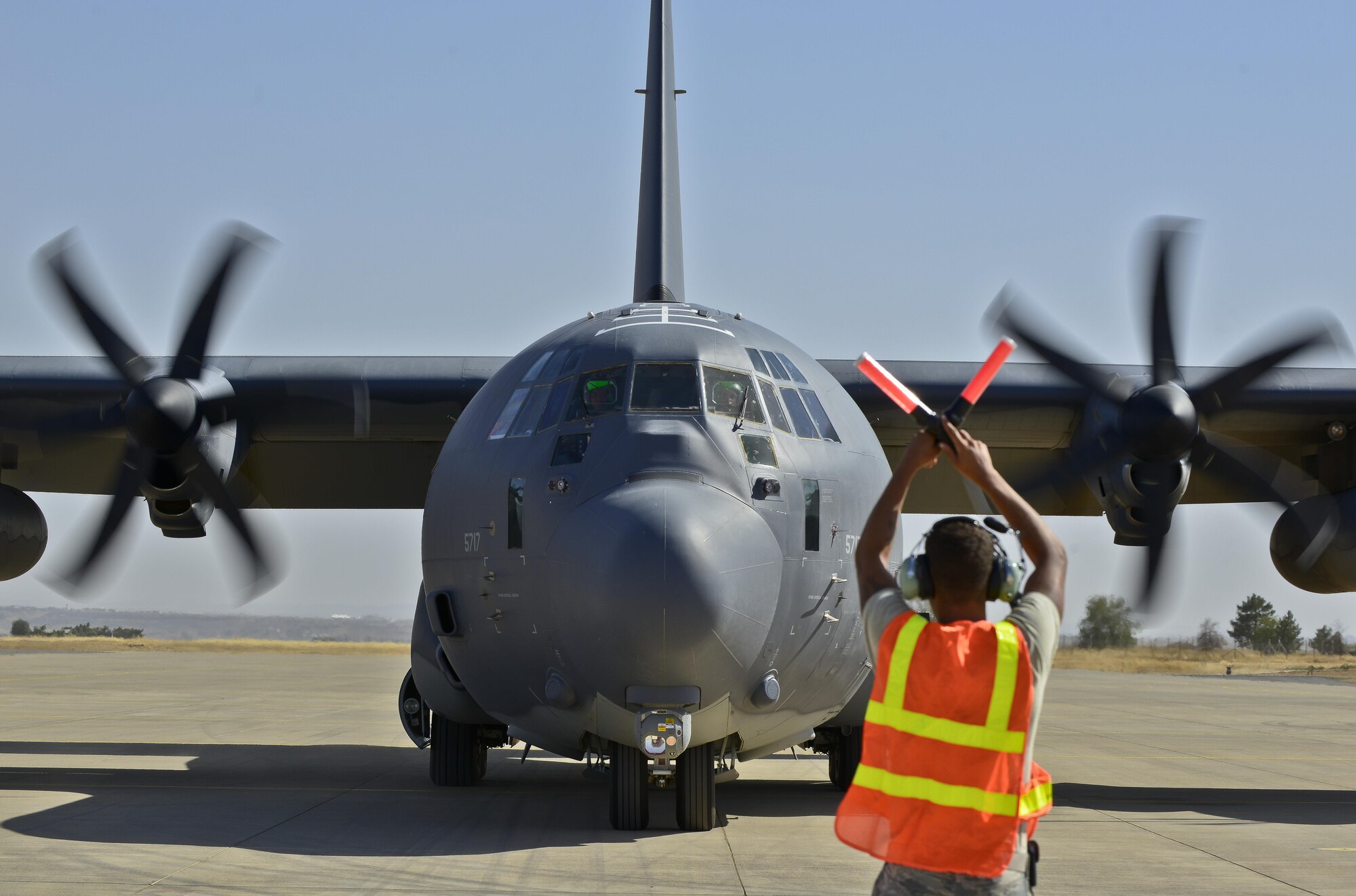 Senior Airman Trenton Mosley, 435th Contingency Response Squadron contingency response crew chief, marshals a HC-130J aircraft Sept. 23, 2015, at Diyarbakir Air Base, Turkey.  The aircraft delivered essential cargo to the Turkish installation as part of the U.S. Air Force’s staging of operations out of DAB to enhance Coalition capabilities to support personnel recovery operations in Syria and Iraq. Diyarbakir Air Base is a Turkish base home to the Turkish air force's 8th Air Wing. (U.S. Air Force photo by Airman Cory W. Bush/Released)