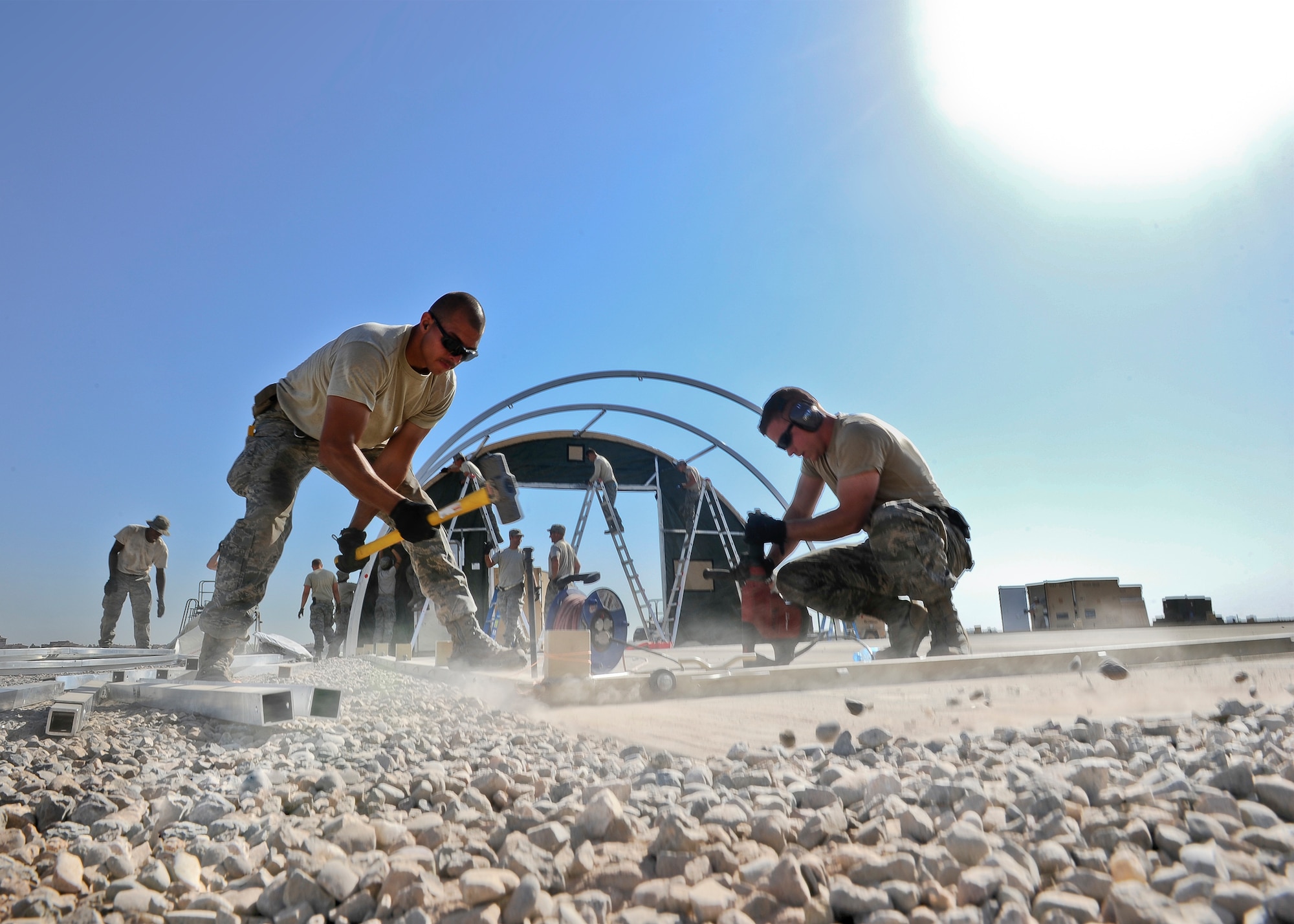 Staff Sgt. Adam Borjon, 435th Construction Training Squadron engineer system’s operator (left), and Senior Airman Alen Turner, 435th CTS pavement and equipment operator, build structures Sept. 23, 2015 in support of personnel recovery operations at Diyarbakir Air Base, Turkey. The 435th Contingency Response Group deployed from Ramstein Air Base, Germany, in support of the U.S. Air Forces Central Command’s staging aircraft and Airmen in southeast Turkey to enhance Coalition capabilities to support personnel recovery operations in Syria and Iraq. (U.S. Air Force photo by Airman Cory W. Bush/Released)