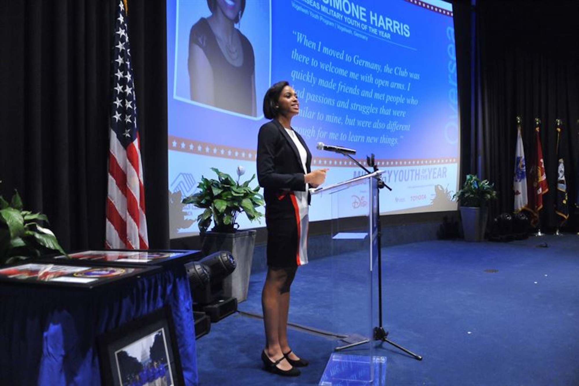 RianSimone Harris, 18, recipient of the joint Defense Department and Boys & Girls Clubs of America 2015 Military Youth of the Year Award, addresses attendees at a ceremony held at the Navy Memorial Naval Heritage Center in Washington, D.C., Aug. 13, 2015. Throughout her progress from the state to national level in the Youth of the Year program, Harris accrued $125,000 in scholarships and plans to attend Point Loma Nazarene University in San Diego, California, to pursue a degree in sociology and criminal justice. (Courtesy photo)