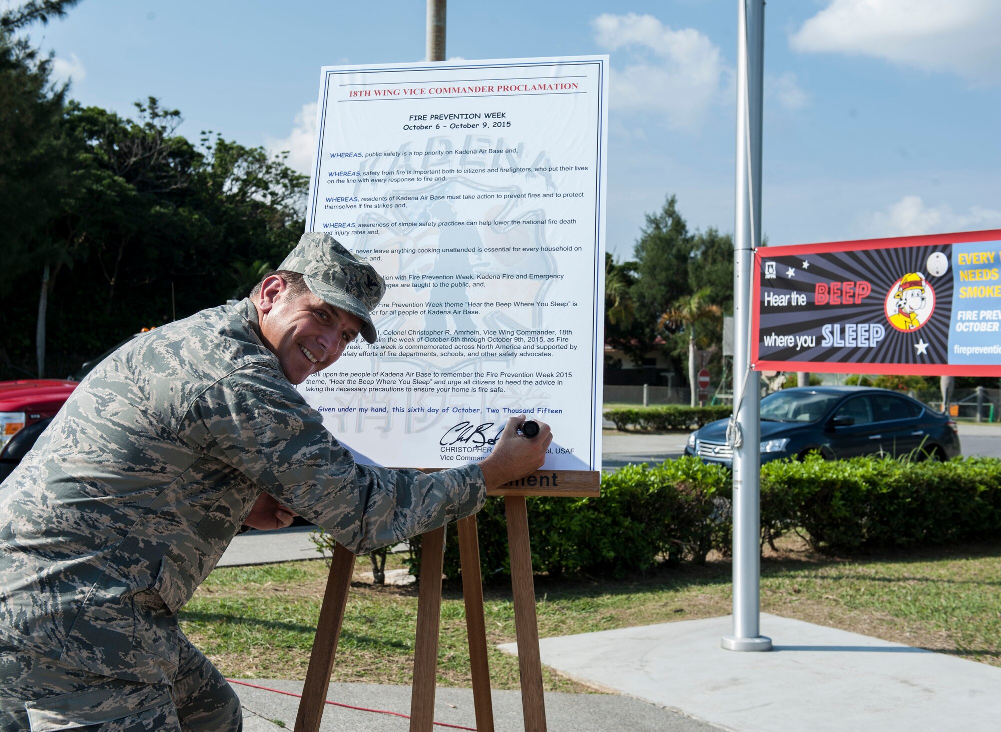 U.S. Air Force Col. Christopher Amrhein, 18th Wing vice commander, signs the 2015 Fire Prevention Week Proclamation Oct. 6, 2015, on Kadena Air Base, Japan.  The signing of this document officially started Fire Prevention Week on Kadena. In addition to the proclamation signing, fire prevention events will be held on Kadena throughout the week of Oct. 6-9. (U.S. Air Force photo by Airman 1st Class Lynette M. Rolen)