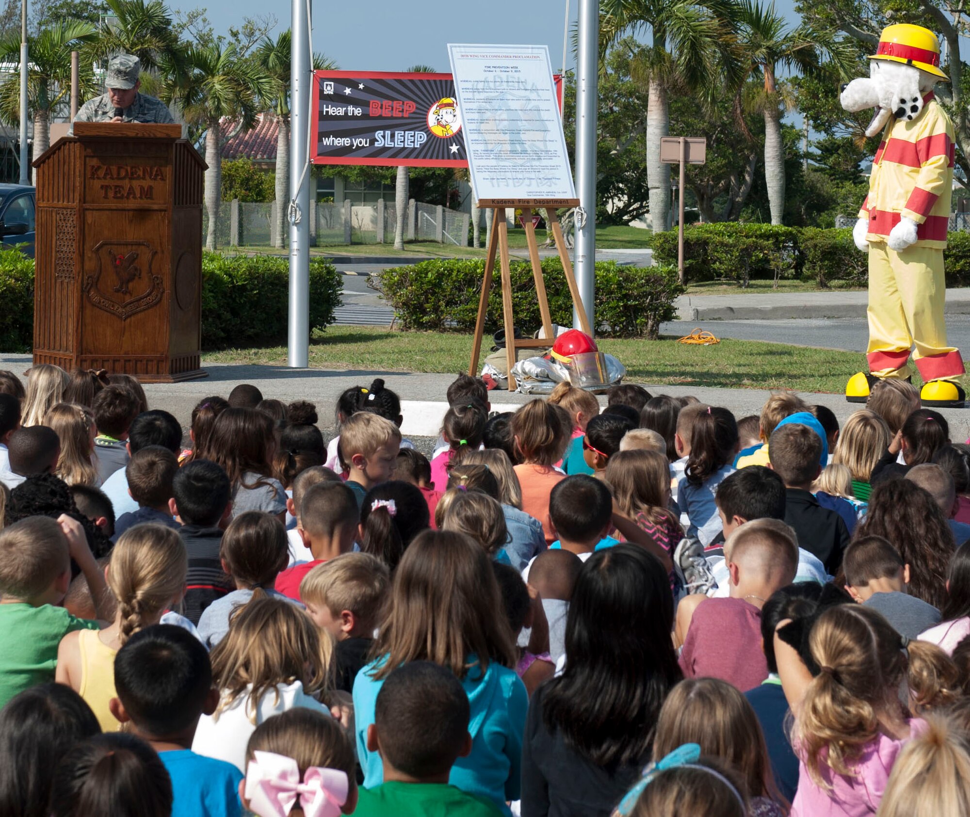 U.S. Air Force Col. Christopher Amrhein, 18th Wing vice commander, speaks to Stearley Heights Elementary School students and staff during the 2015 Kadena Fire Prevention Week Proclamation Oct. 6, 2015, on Kadena Air Base, Japan. Amrhein spoke about the importance of fire safety and the significance of being vigilant of fire hazards year round. (U.S. Air Force Photo by Airman 1st Class Lynette M. Rolen)
