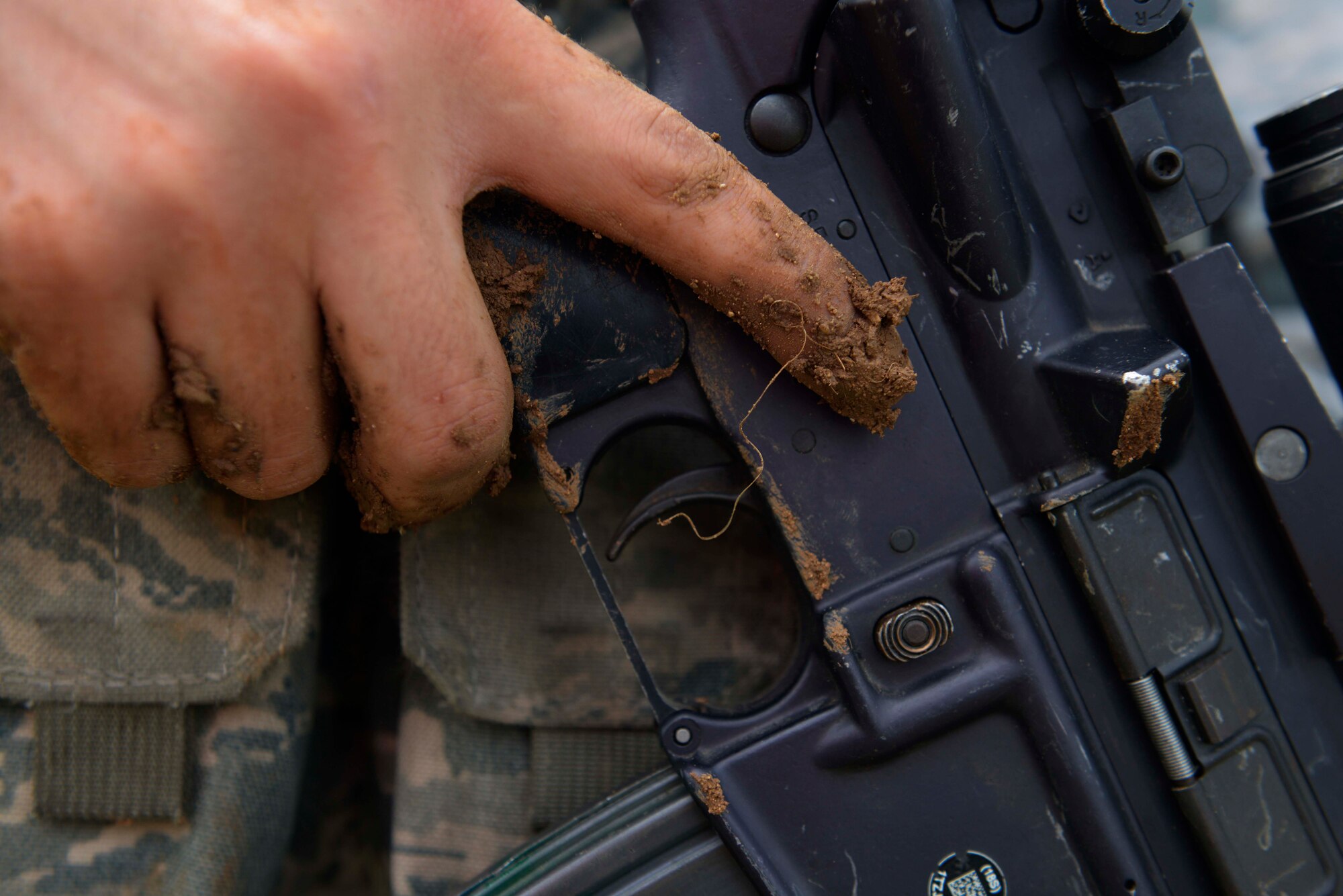 Airman 1st Class Miller Swanson, 39th Security Forces Squadron security response team member, provides security after searching Airmen acting as aggressive forces during a wing-wide exercise Oct. 2, 2015, at Incirlik Air Base, Turkey. As part of the exercise, Swanson assisted in eliminating mock opposing forces and demonstrated the correct way to perform a body search to wing inspection team members. (U.S. Air Force photo by Senior Airman Krystal Ardrey/Released)