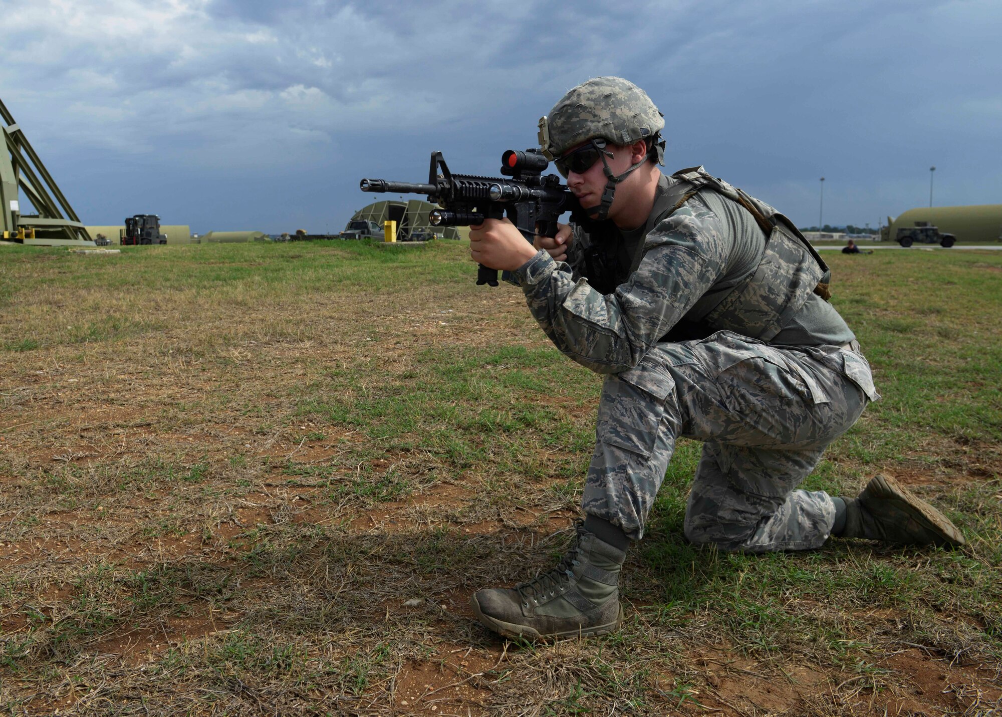Airman 1st Class Patrick Morrison, 39th Security Forces Squadron security response team member, provides security during a wing-wide exercise Oct. 2, 2015, at Incirlik Air Base, Turkey. Morrison ensured the area was secure while fellow defenders demonstrated proper body searching techniques to wing inspection team members. (U.S. Air Force photo by Senior Airman Krystal Ardrey/Released)