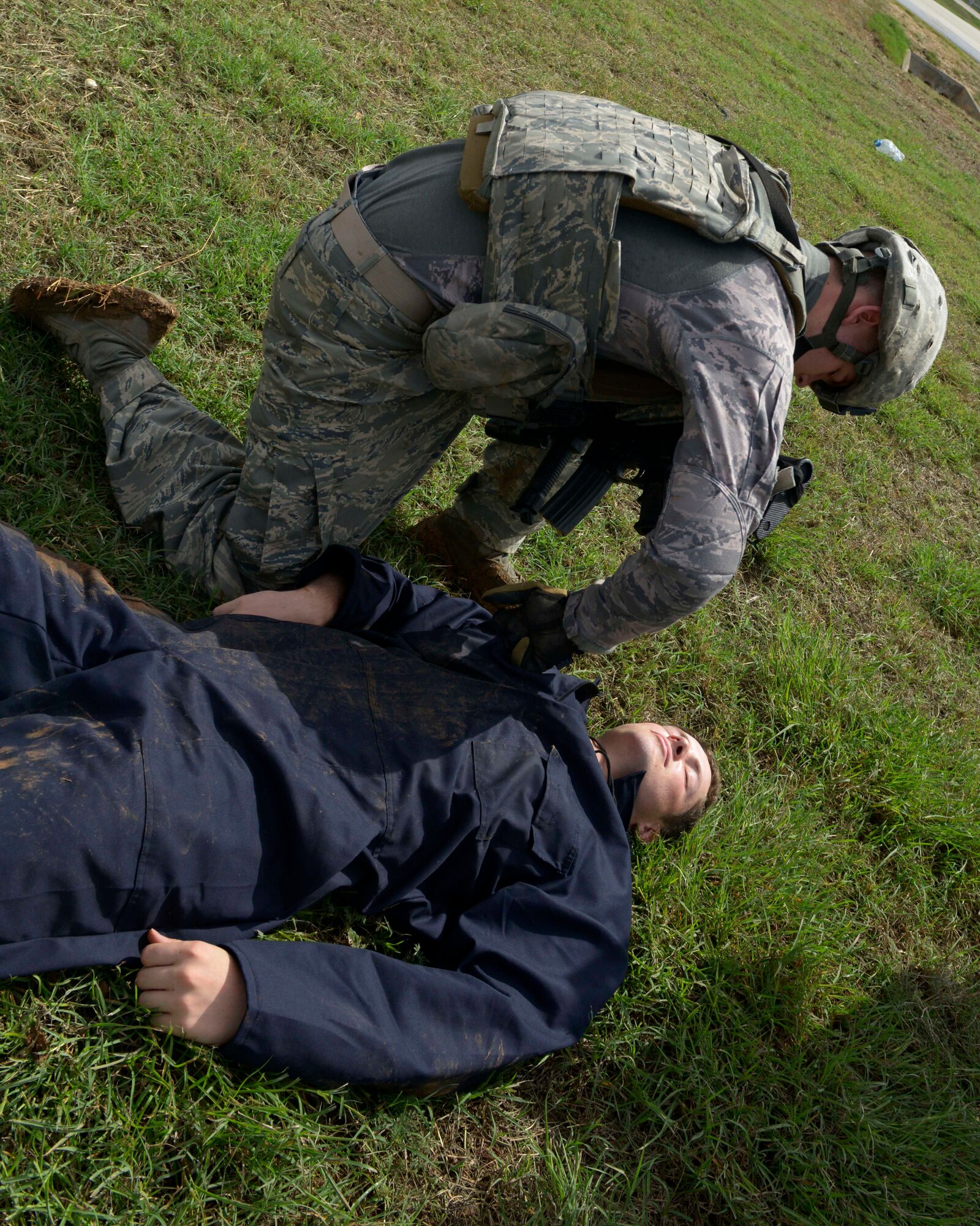 Airman 1st Class Collin Workman, 39th Security Forces Squadron security response team member, searches Airman 1st Class Samuel Buchholz, 39th Operations Support Squadron ground radar maintainer, during a wing-wide exercise Oct. 2, 2015, at Incirlik Air Base, Turkey. The exercise was held to test the base’s first responders, allow them to hone their skills and maintain their readiness to respond to emergency situations. (U.S. Air Force photo by Senior Airman Krystal Ardrey/Released)