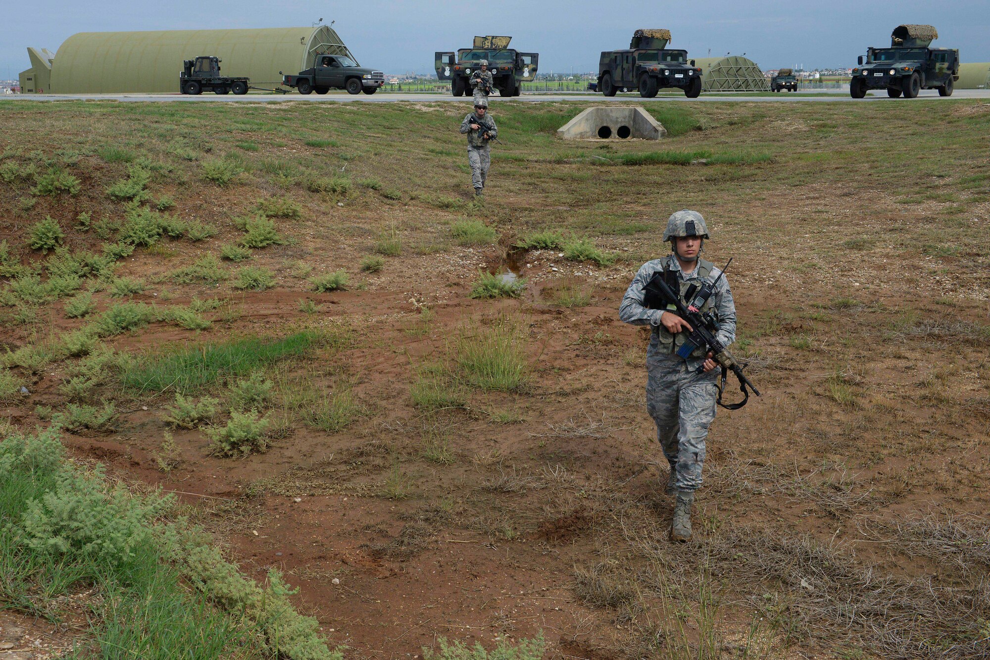 Airmen from the 39th Security Forces Squadron patrol the area to establish a security perimeter during a wing-wide exercise Oct. 2, 2015, at Incirlik Air Base, Turkey. The exercise tested the base's readiness and ability to respond to an emergency at a moment's notice. (U.S. Air Force photo by Senior Airman Krystal Ardrey/Released)