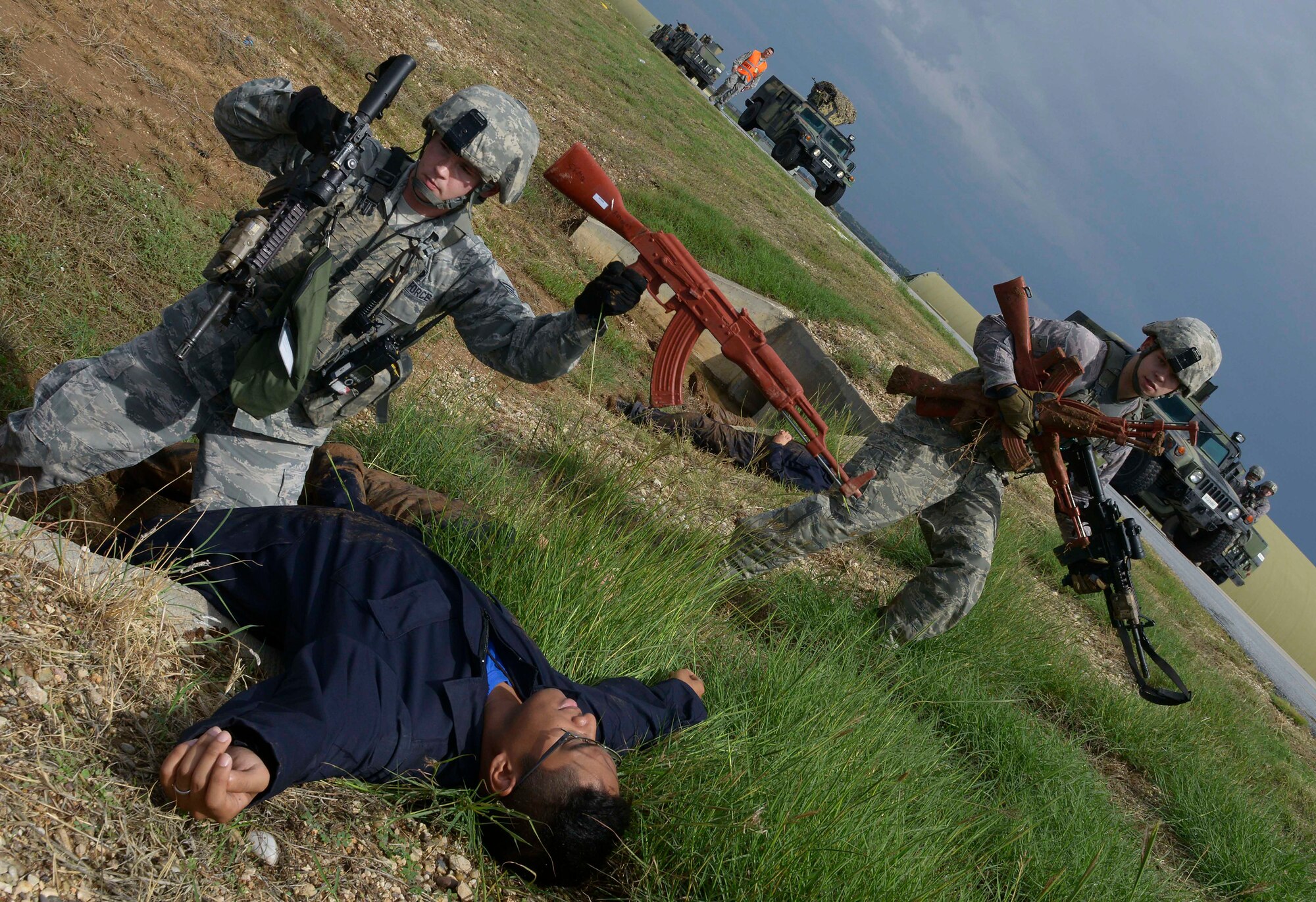 Airman 1st Class Miller Swanson, 39th Security Forces Squadron security response team member, disarms Airmen 1st Class Mark Trusty, 39th Operations Support Squadron ground radar maintainer, acting as aggressive force, during a wing-wide exercise Oct. 2, 2015, at Incirlik Air Base, Turkey. As part of the exercise, the 39th Security Forces Squadron defended a convoy from ambush to enhance their overall readiness and test their response to an emergency situation. (U.S. Air Force photo by Senior Airman Krystal Ardrey/Released)