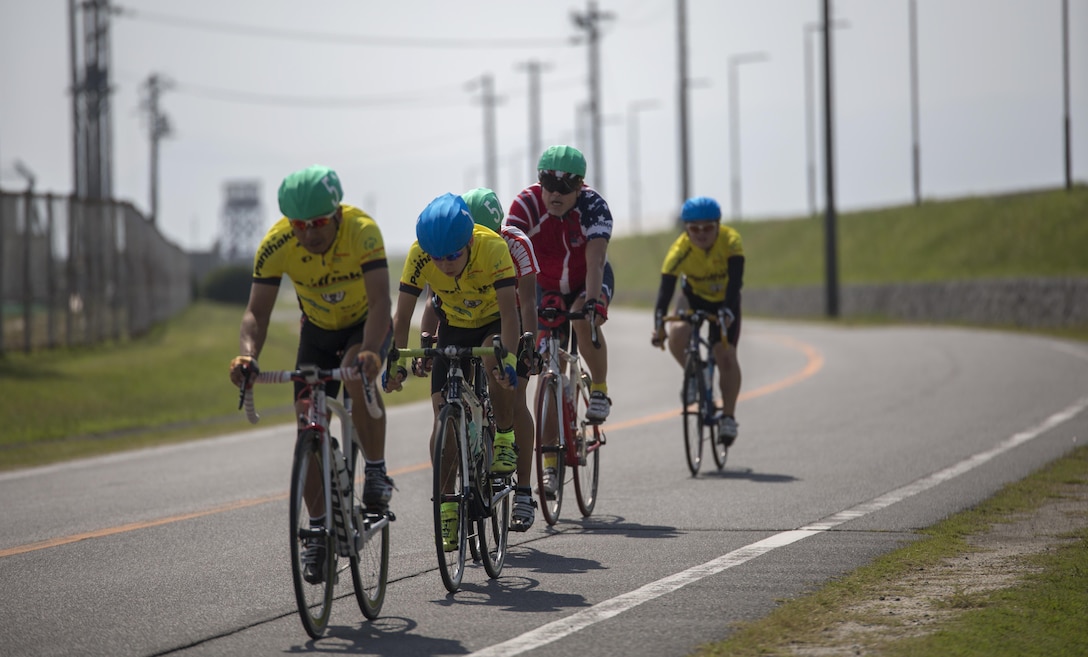 Cyclists race toward the finish line during the Special Olympics Hiroshima at Marine Corps Air Station Iwakuni, Japan, Oct. 4, 2015. This sporting program helps instill confidence, inspire competitors, and improve athlete health through the transformative power of sports.