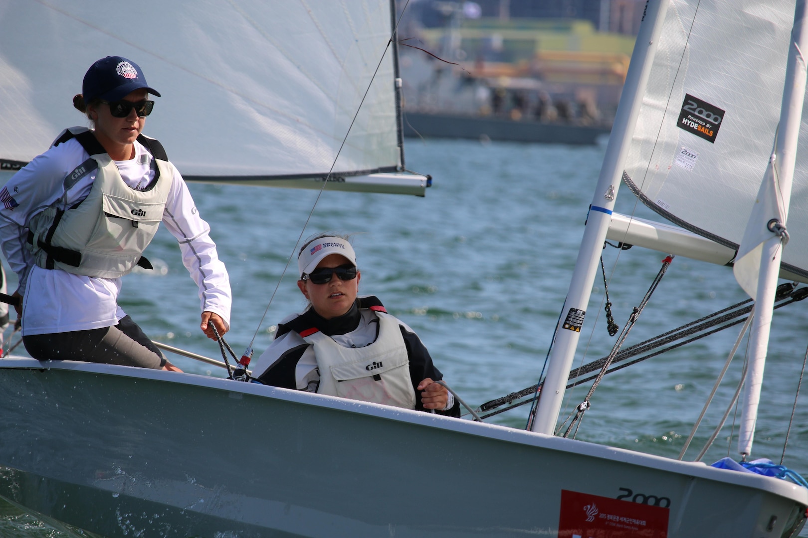 U.S. Women's Sailing team, with Navy Lt. Trisha Kutkiewicz (right) and Ensign Mary Hall (left) capture the gold medal in the 6th Conseil International du Sport Militaire (CISM), ouscoring Russia by one point for their first trip to the top of the podium since 2005. CISM Military World Games were held 2-11 October in Mungyeong, South Korea.